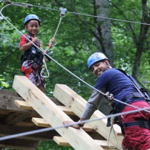 Father and son on the kid zip